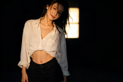 Attractive woman in a white shirt and shorts, posing in Kuala Lumpur