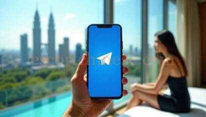 Hand holding a phone with the Telegram app open, overlooking a city skyline